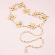 Load image into Gallery viewer, A gold-tone chain belt featuring multiple floral links and an adjustable chain extender, displayed on a white background.