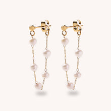 Load image into Gallery viewer, Gold earrings with pearl beads on a white background