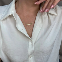 Load image into Gallery viewer, Person in a white collared shirt with pink nails wearing a gold mamacita necklace