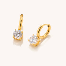 Load image into Gallery viewer, Gold hoop earrings with clear gemstones on a white background