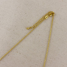 Load image into Gallery viewer, Gold chain necklace on a beige fabric background