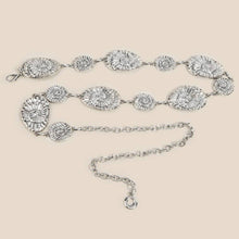 Load image into Gallery viewer, Silver belt with disc-like shell designs on a beige background with an extended chain.