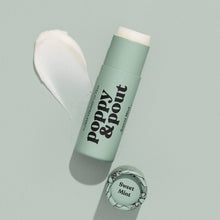 Load image into Gallery viewer, A mint green lip balm stick labeled 'poppy & pout' with 'Sweet Mint' printed on a small circular cap, shown on a pale mint background with a white balm smear and soft shadows.