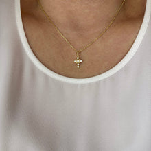 Load image into Gallery viewer, Gold necklace with a cross pendant worn by a person in a white tank top.