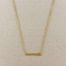 Load image into Gallery viewer, Gold Mamacita Necklace with a beige fabric background