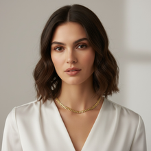 Load image into Gallery viewer, Woman wearing a gold necklace and white top against a neutral background
