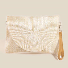 Load image into Gallery viewer, An ivory braided clutch with an off white background 
