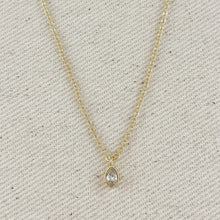 Load image into Gallery viewer, Gold necklace with a teardrop-shaped pendant on a textured beige background
