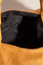 Load image into Gallery viewer, Close-up of a brown leather bag with a black interior
