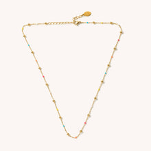 Load image into Gallery viewer, Gold necklace with small gold and colorful beads on a white background
