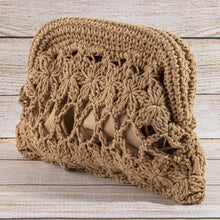 Load image into Gallery viewer, Khaki crocheted bag featuring a floral crochet pattern, open lattice detailing, and a textured woven border, displayed on a light wood surface.

